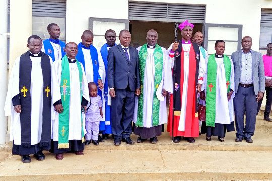 The Reverends, principal pose a photo with the Bishop